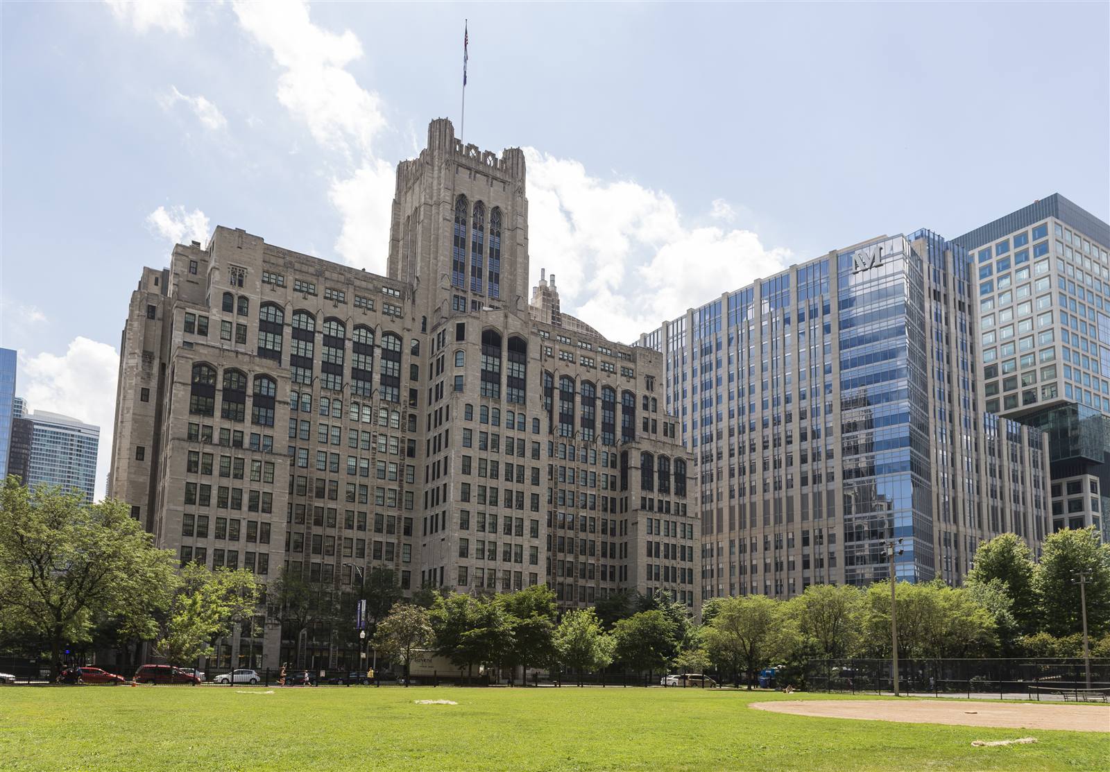 Chicago campus buildings behind a green lawn